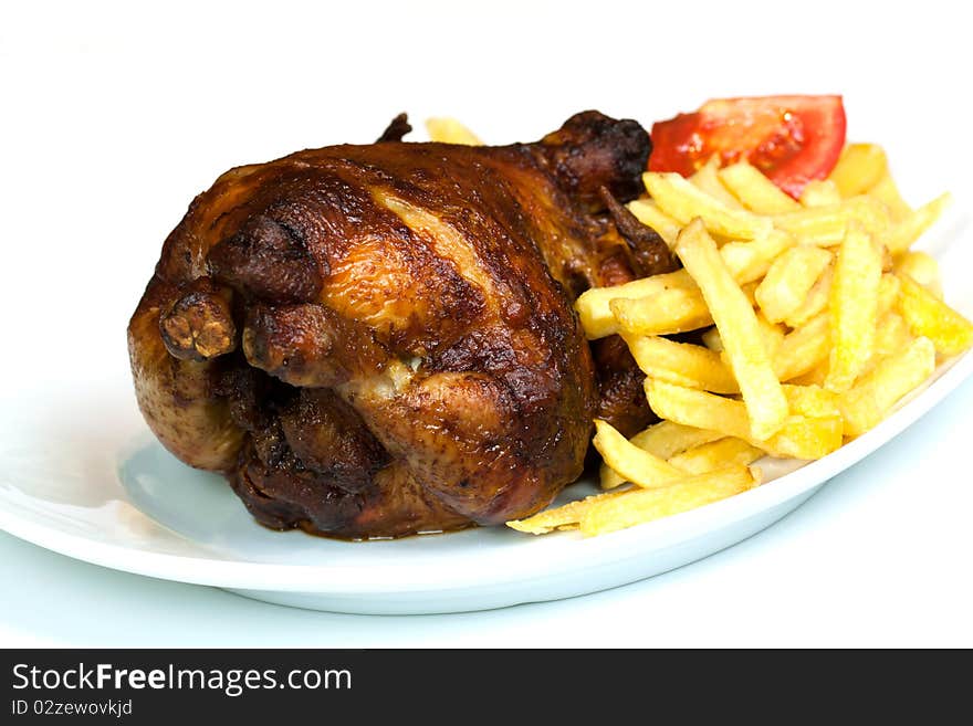 Fresh Roast chicken, isolated on white, with brown crust,fries