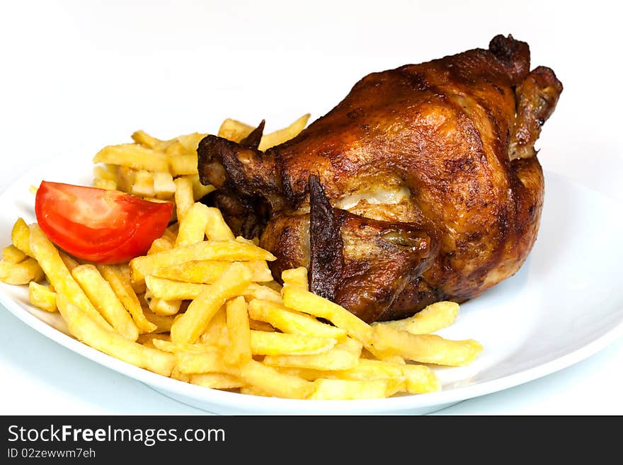 Fresh Roast chicken, isolated on white, with brown crust,fries