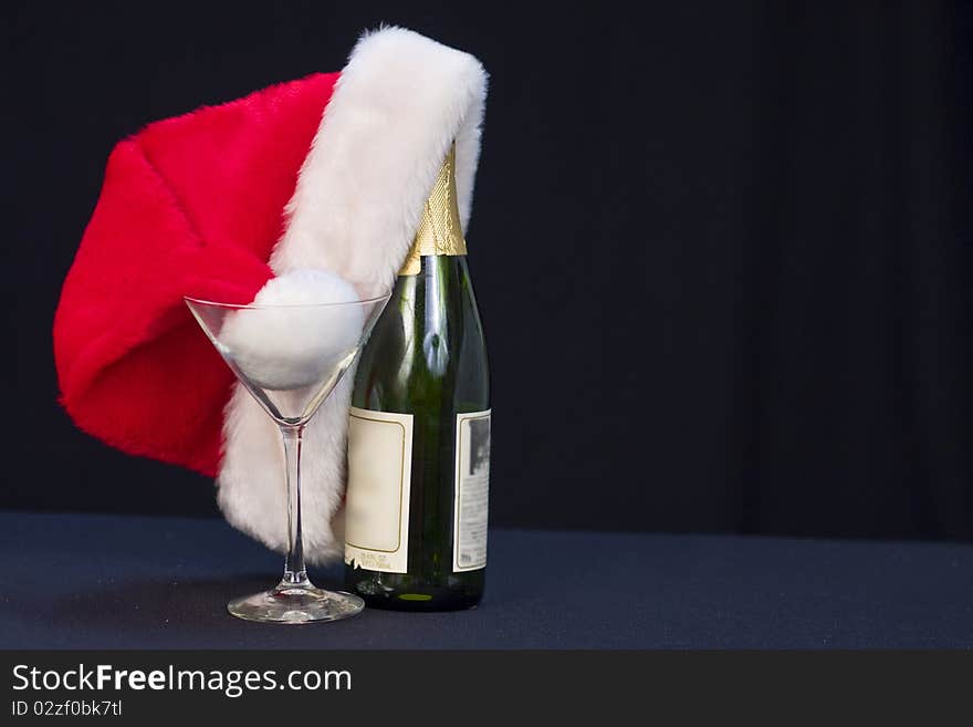 Santa's hat with bottle of wine/champagne. Santa's hat with bottle of wine/champagne