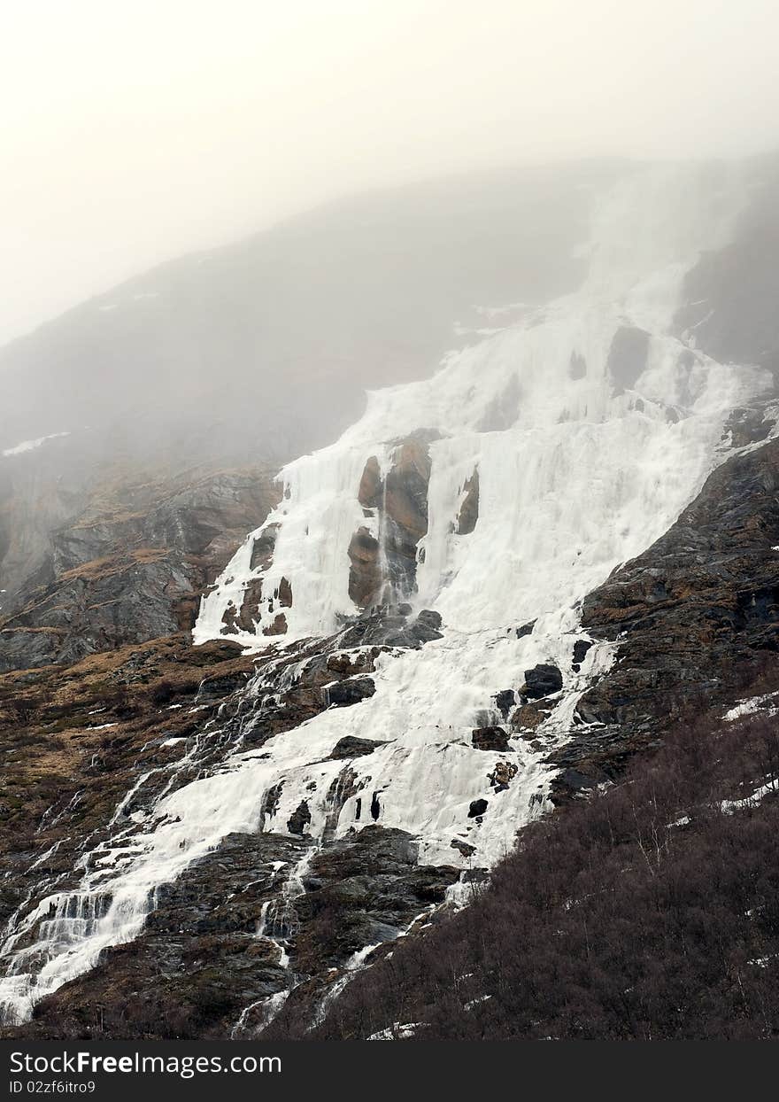 Frozen waterfall in highland of norway