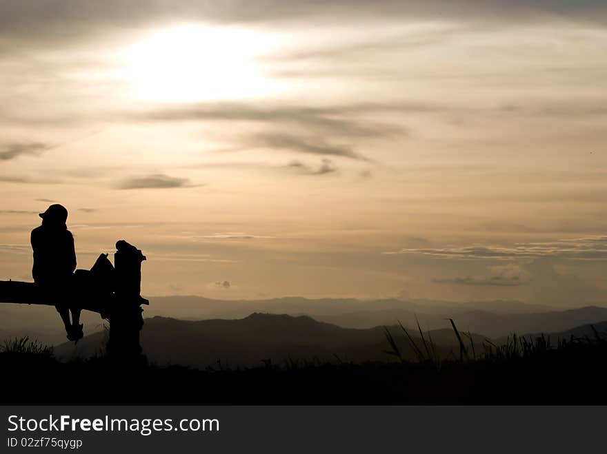 Girl sits on the hill Chiangmai Thailand