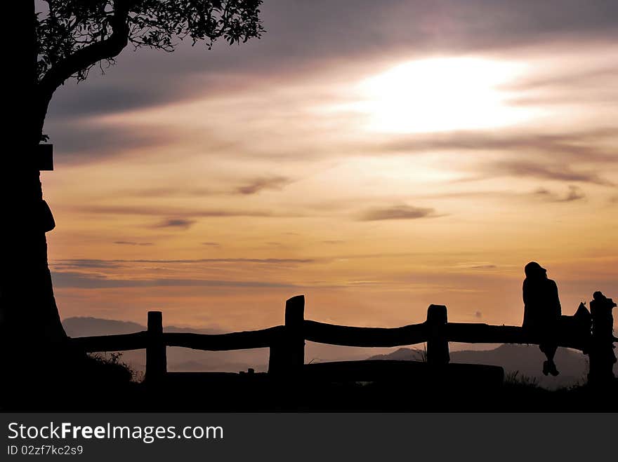 Girl sits on the hill Chiangmai Thailand