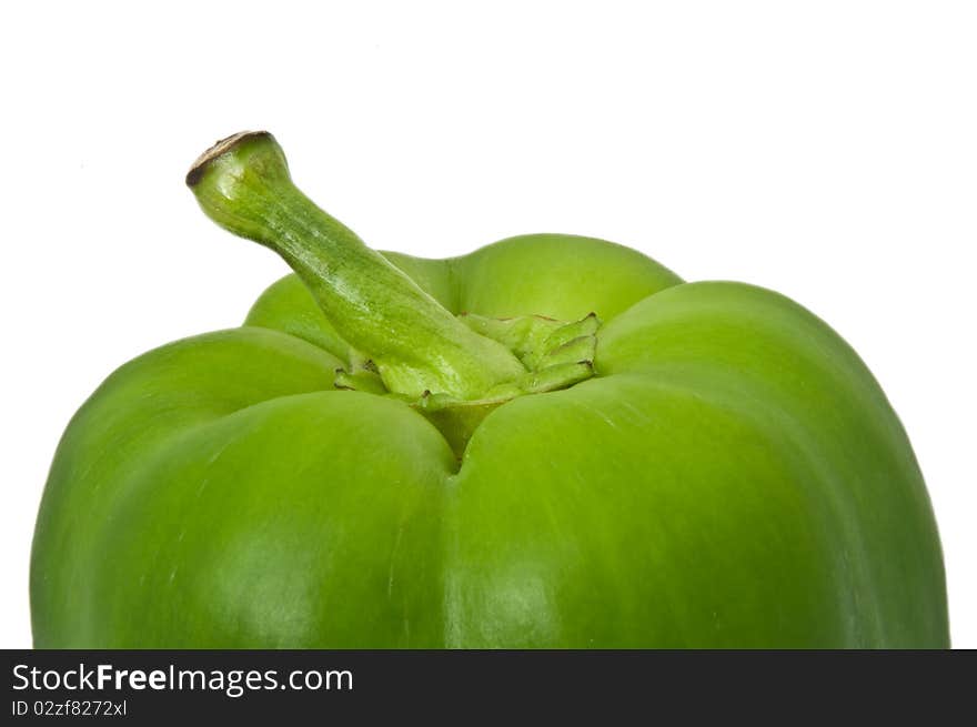 Close up capturing the top portion of a green bell pepper with white background. Close up capturing the top portion of a green bell pepper with white background.