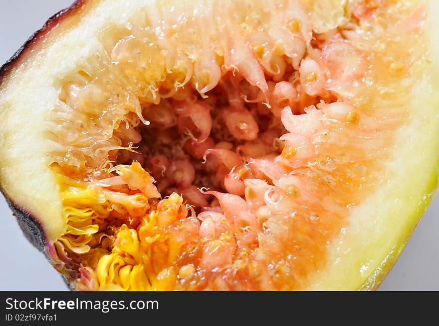 Closeup of cut fig. For healthy lifestyle and fruit concepts. Closeup of cut fig. For healthy lifestyle and fruit concepts.