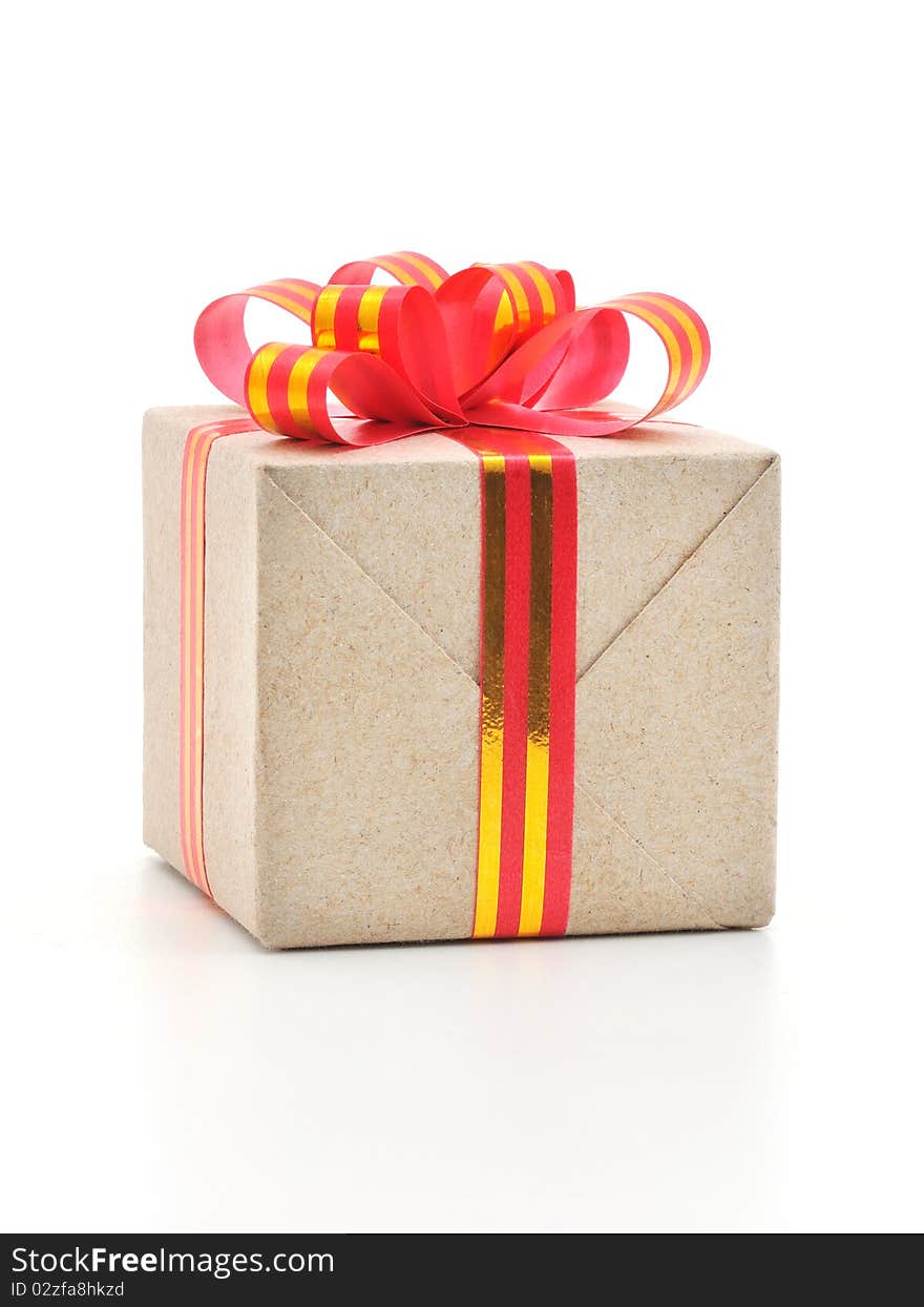 Gift box with gold and red ribbon in white background.