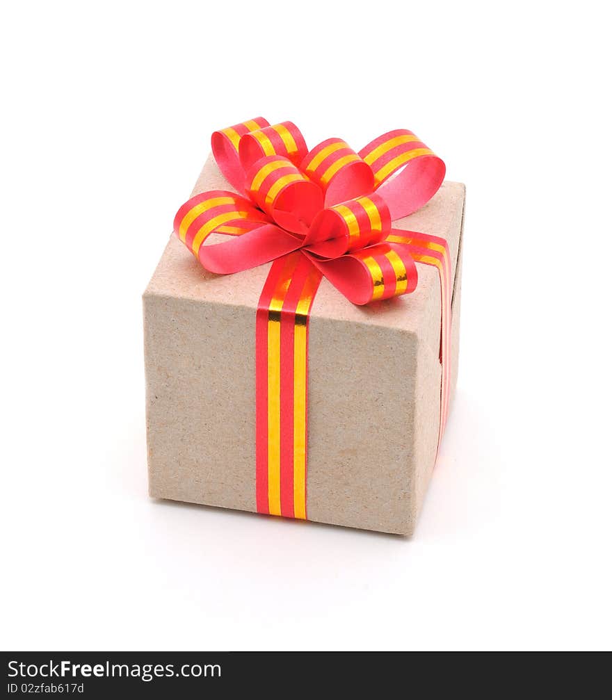 Gift box with gold and red ribbon in white background.