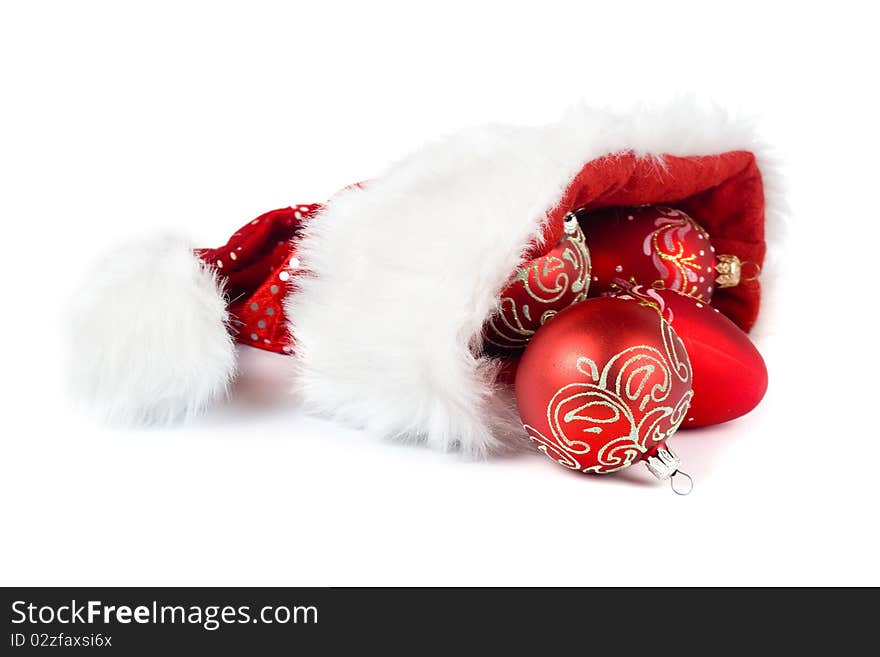 Santa Claus hat with Christmas ornaments isolated on white background