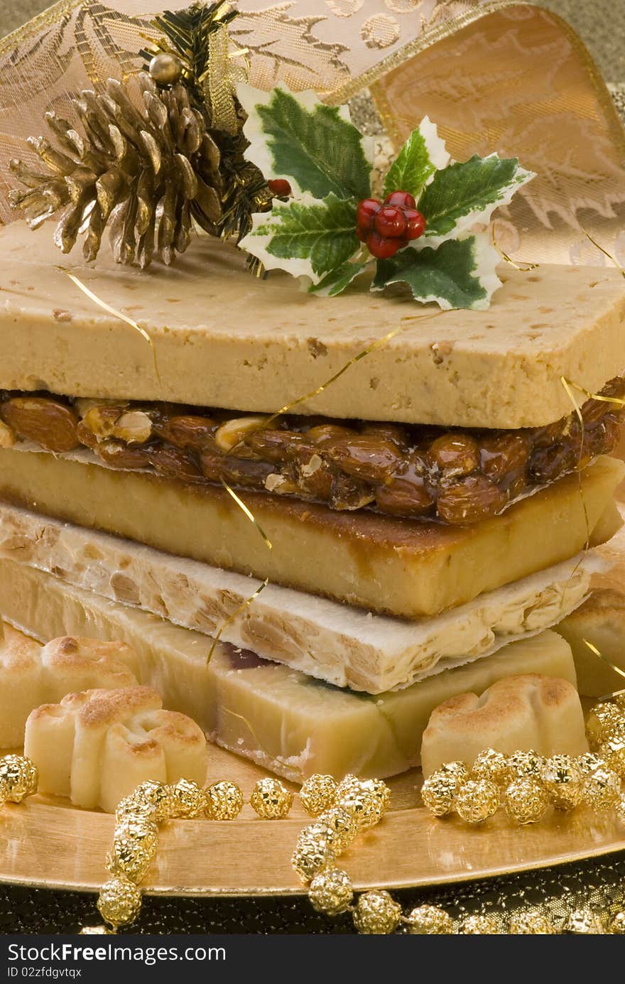 Typical Spanish Christmas nougat in a golden plate