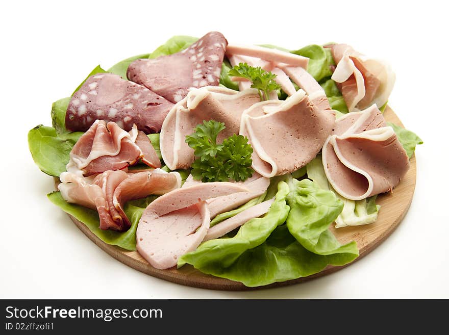 Mixed sausage plate with lettuce leaf