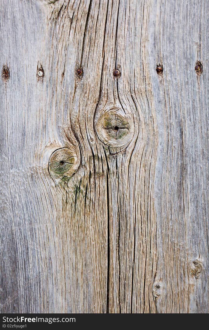 A Wooden Fence With Nails