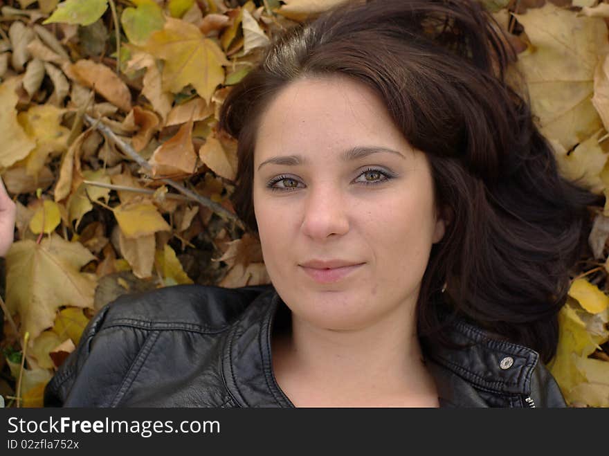 Girl lying on the autumn leaves. Girl lying on the autumn leaves