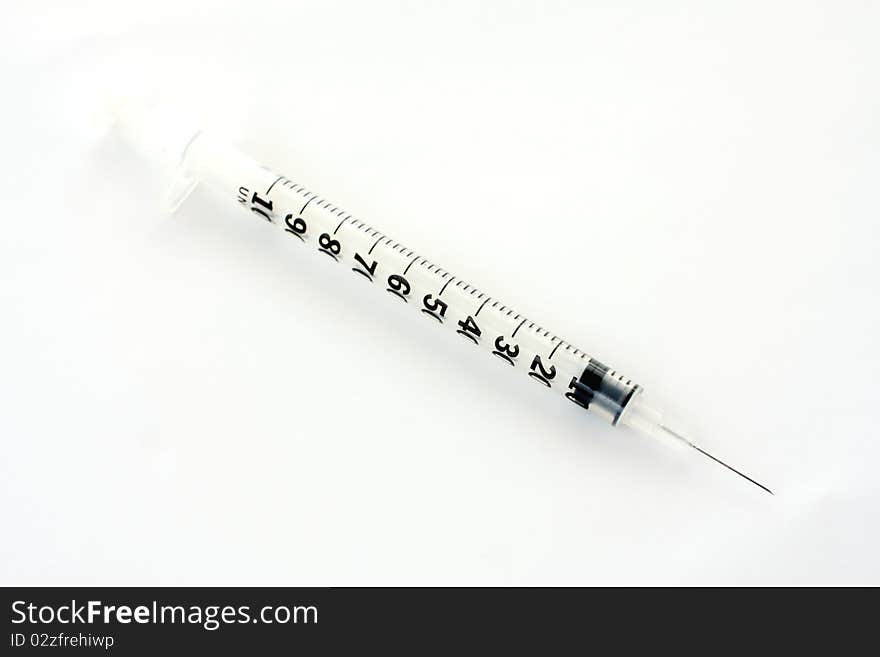 Small hypodermic syringe.