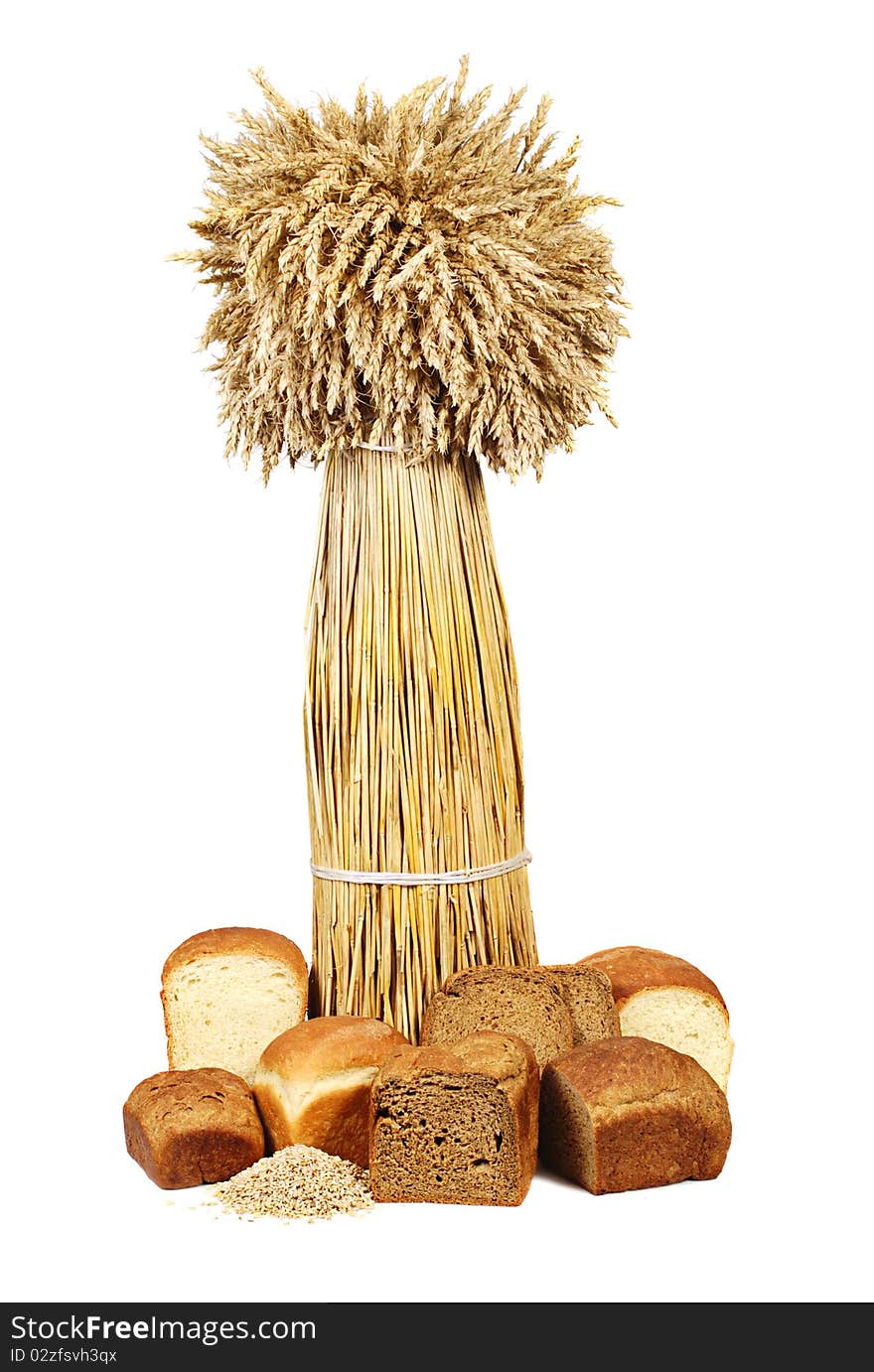 Sheaf of wheat and bread on a white background