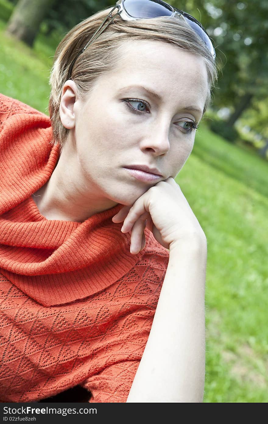 The woman relaxes with the autumn in the park. The woman relaxes with the autumn in the park