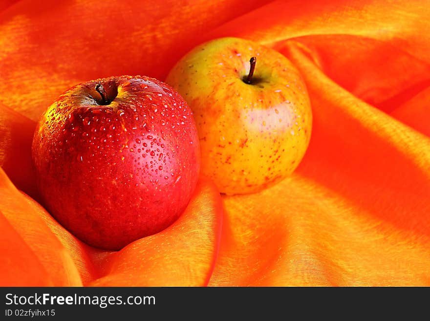 Two fresh apple with water drops