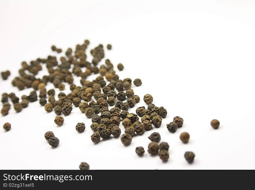 Some peppercorns on a table