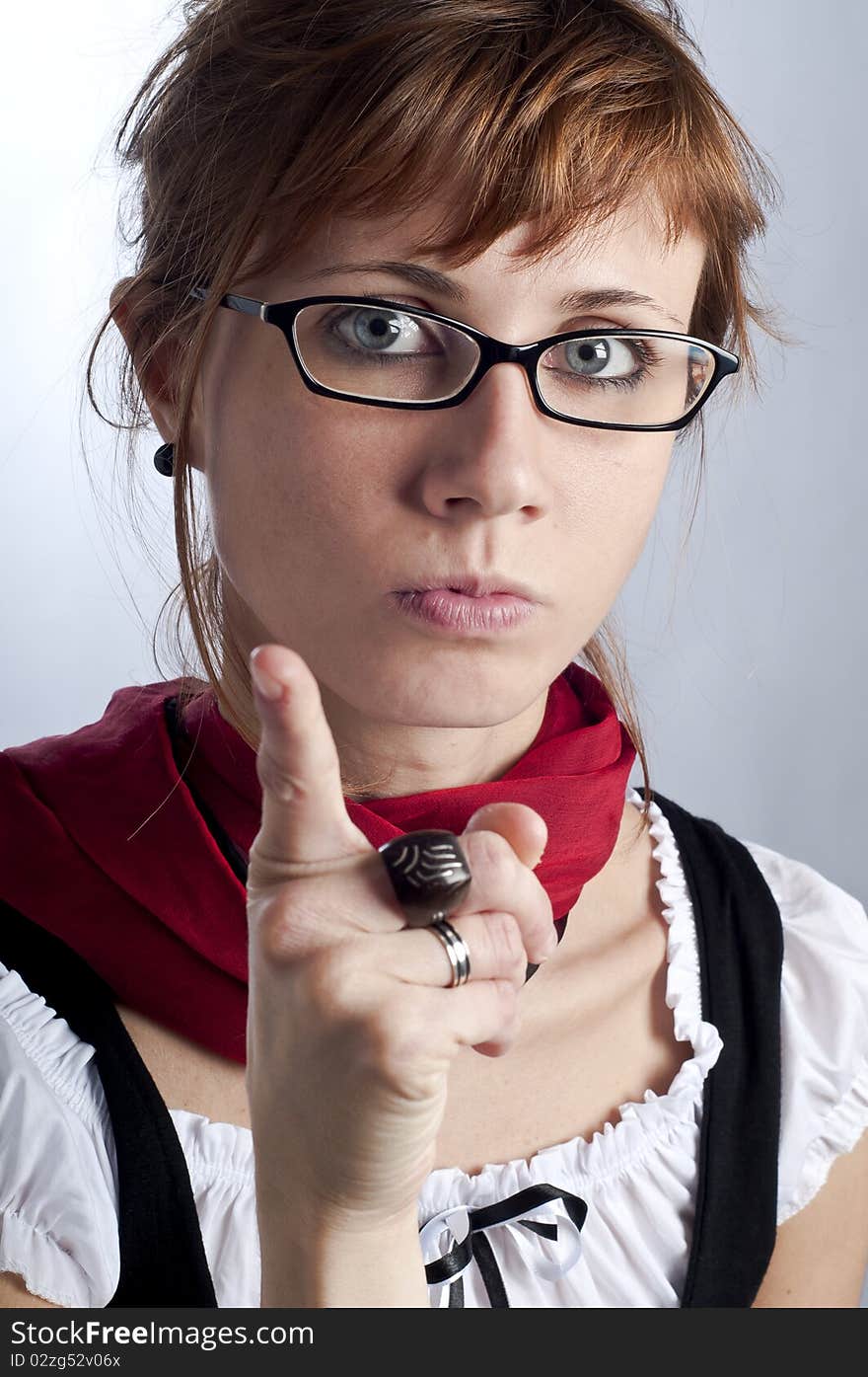 Blonde girl with glasses, pen and book