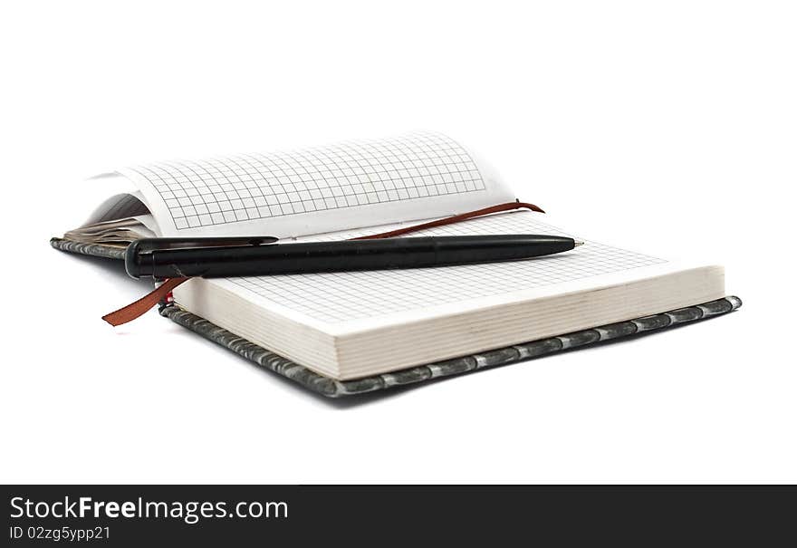 Diary with a pen on a white background