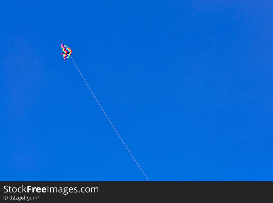 Colorful kite on blue sky