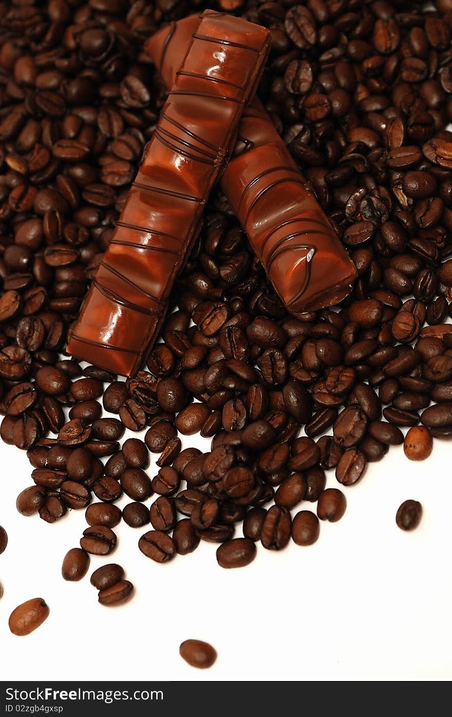 Coffee beans and chocolate on white background. Coffee beans and chocolate on white background