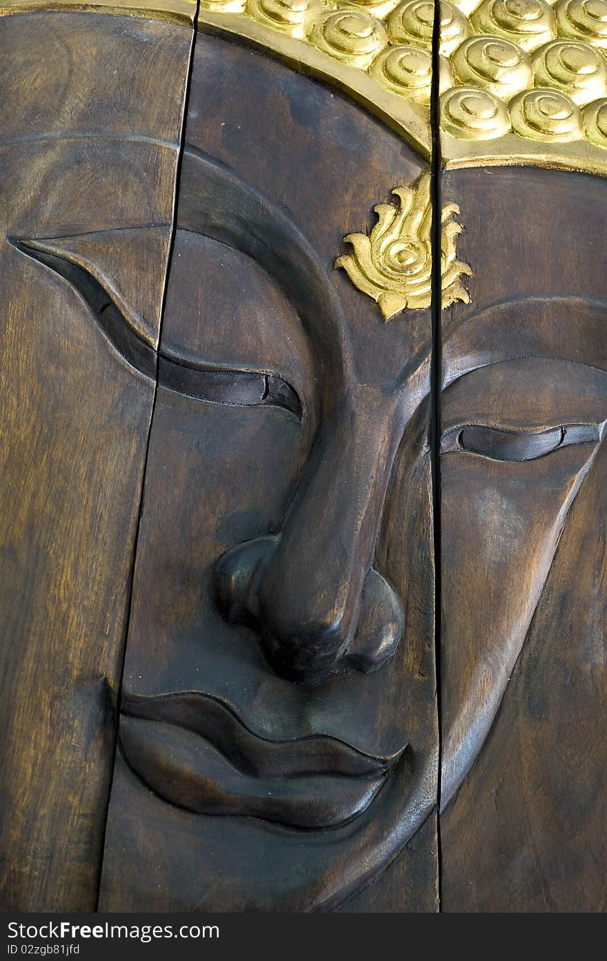 Wooden Buddha Image face decorated with gold