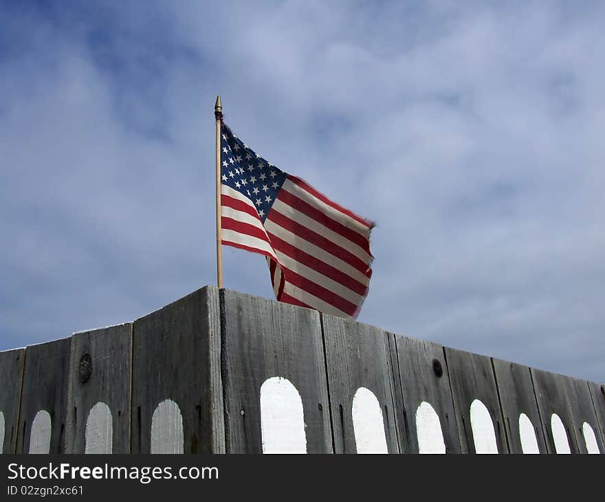 US Flag Behind Fence