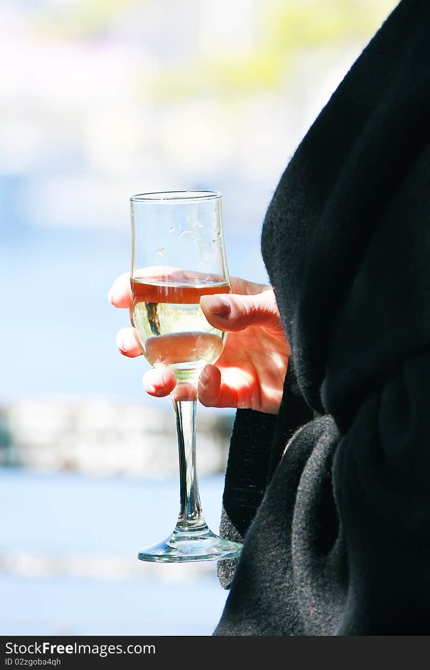 Female hand holding a glass of wine