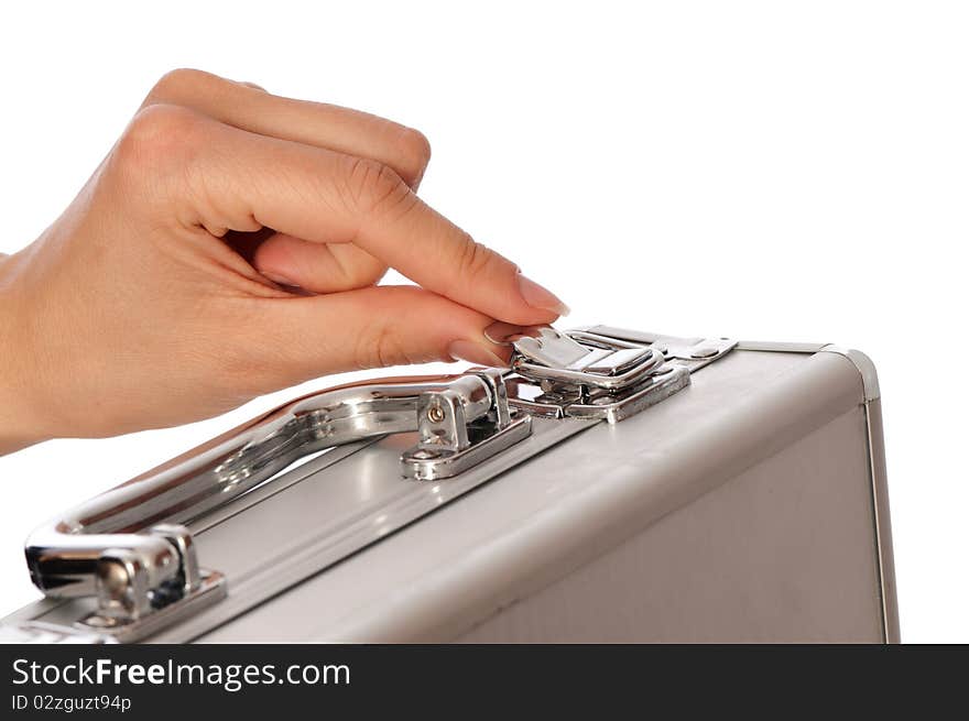 Woman unlocking metal grey case with money. Woman unlocking metal grey case with money