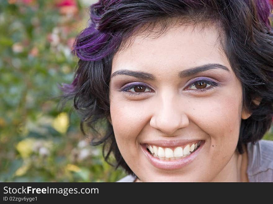 Portrait of a young woman smiling. Portrait of a young woman smiling.