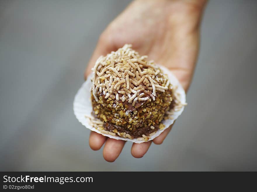 Chocolate cupcake with chestnut shavings on top.