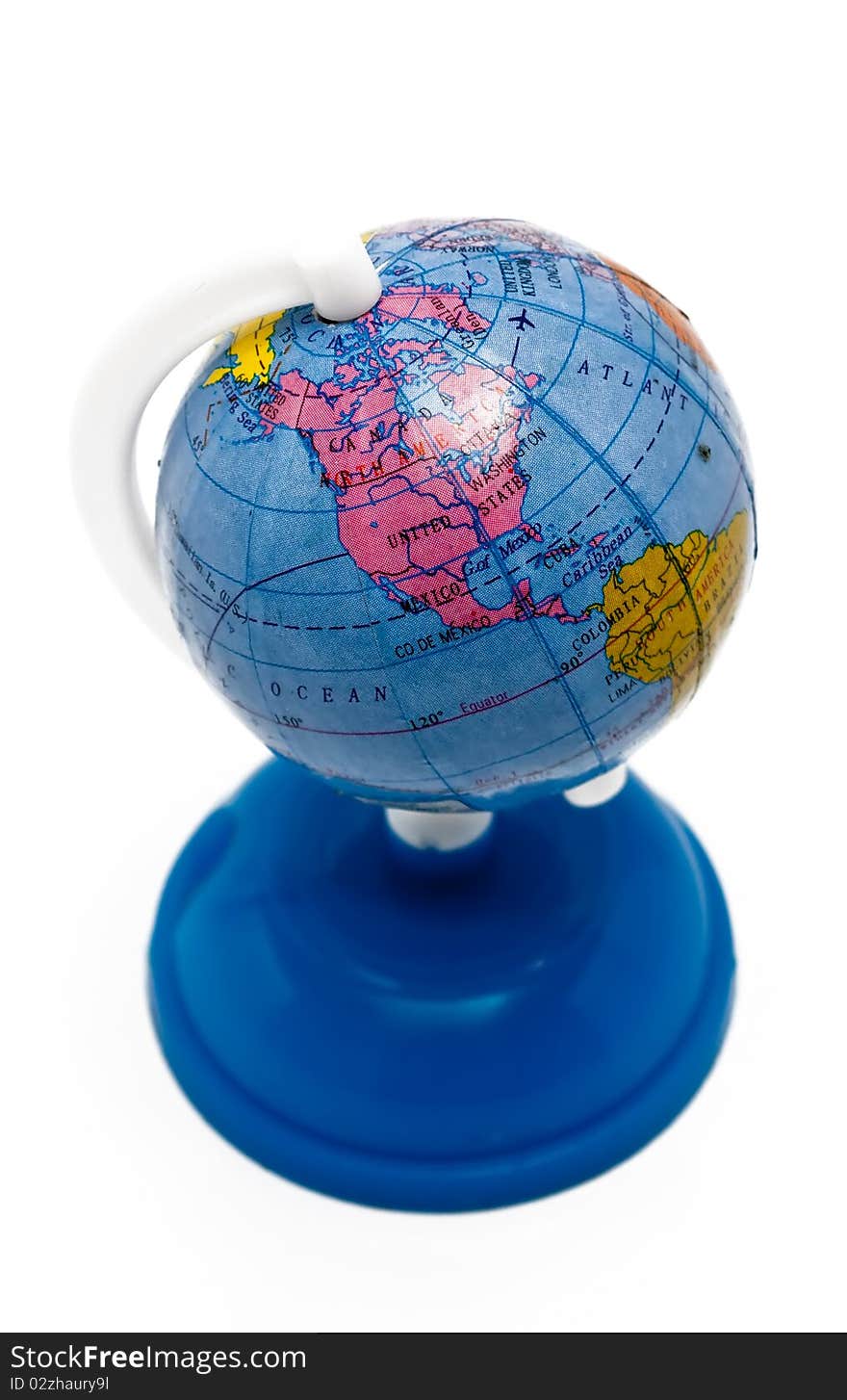 Small globe on a blue stand isolated on a white background. Small globe on a blue stand isolated on a white background