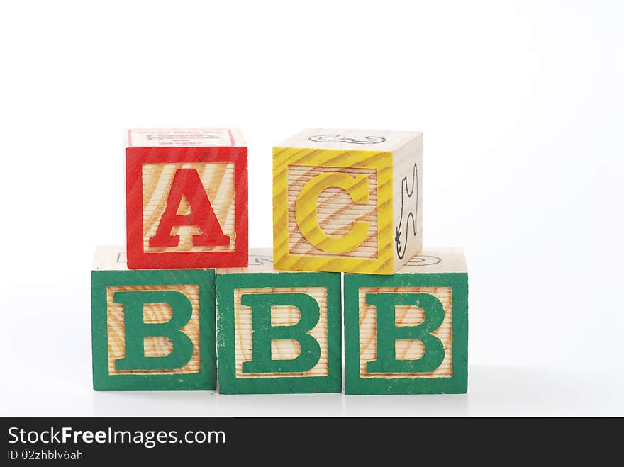 Children learning letter blocks isolated on white. Children learning letter blocks isolated on white