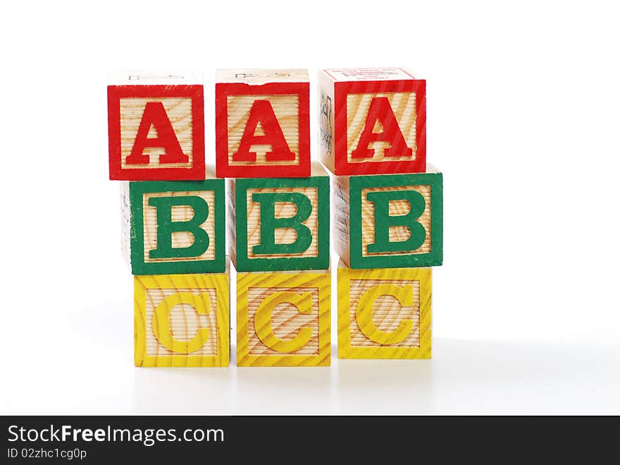 Children learning letter blocks isolated on white. Children learning letter blocks isolated on white