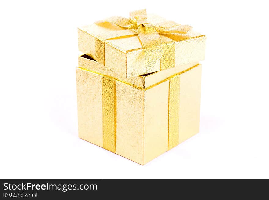 Christmas open giftbox on white background, with golden ribbon