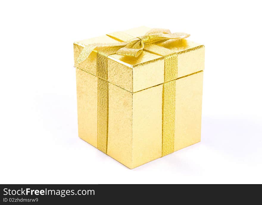 Christmas golden  giftbox on white background, with golden ribbon. Christmas golden  giftbox on white background, with golden ribbon