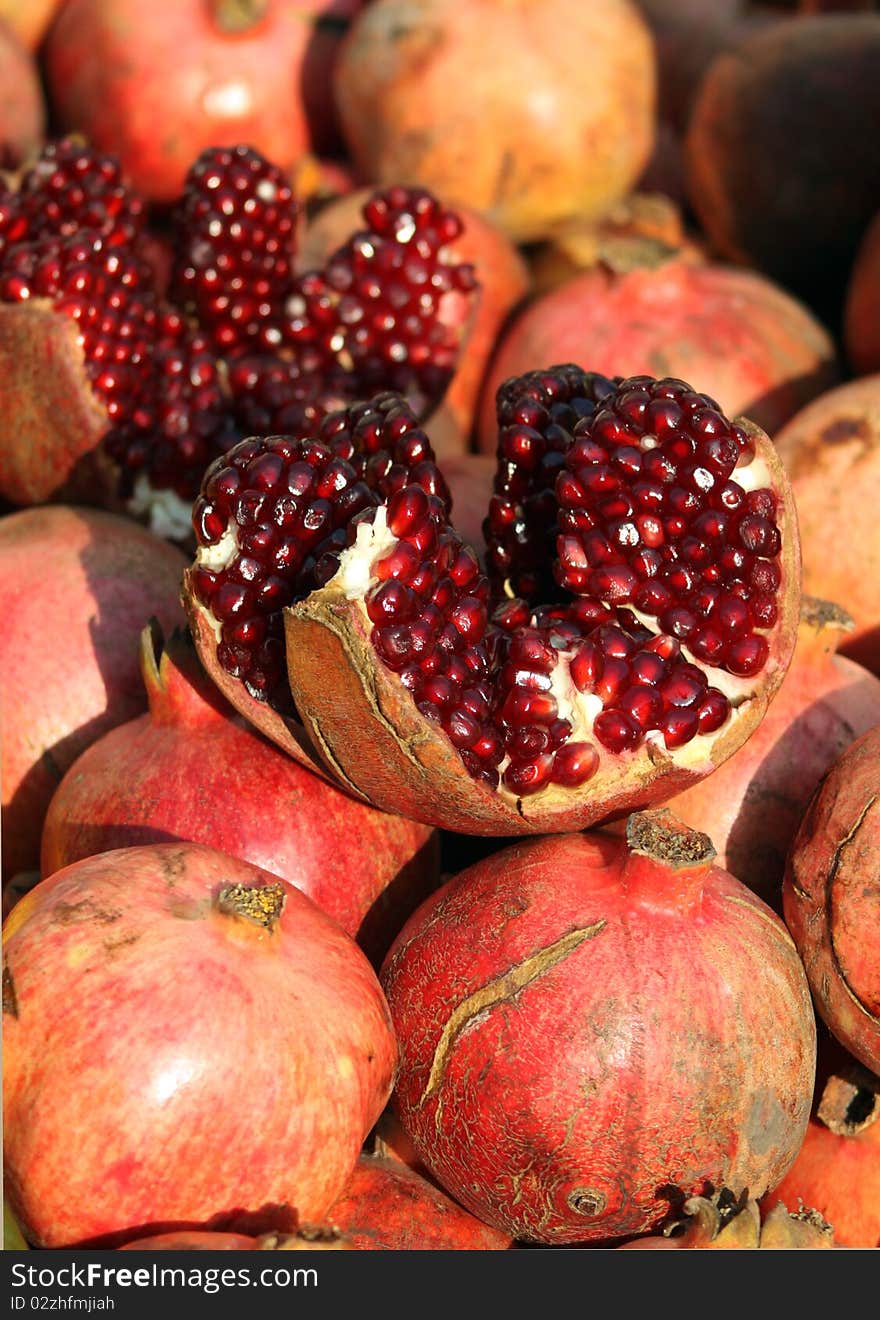 A view of pomegranate in the greengrocer. It's seem red.