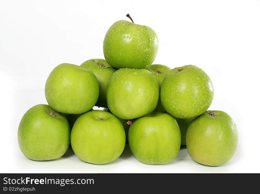 Several green apples on white background