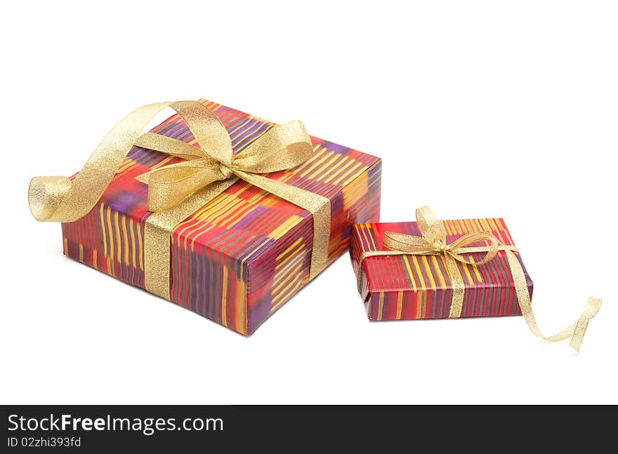 Holiday gift boxes decorated with ribbon isolated on white