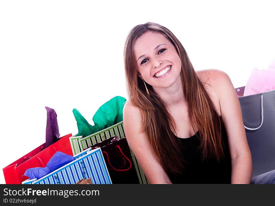 A happy girl with shopping bags, isolated on a white background. A happy girl with shopping bags, isolated on a white background.