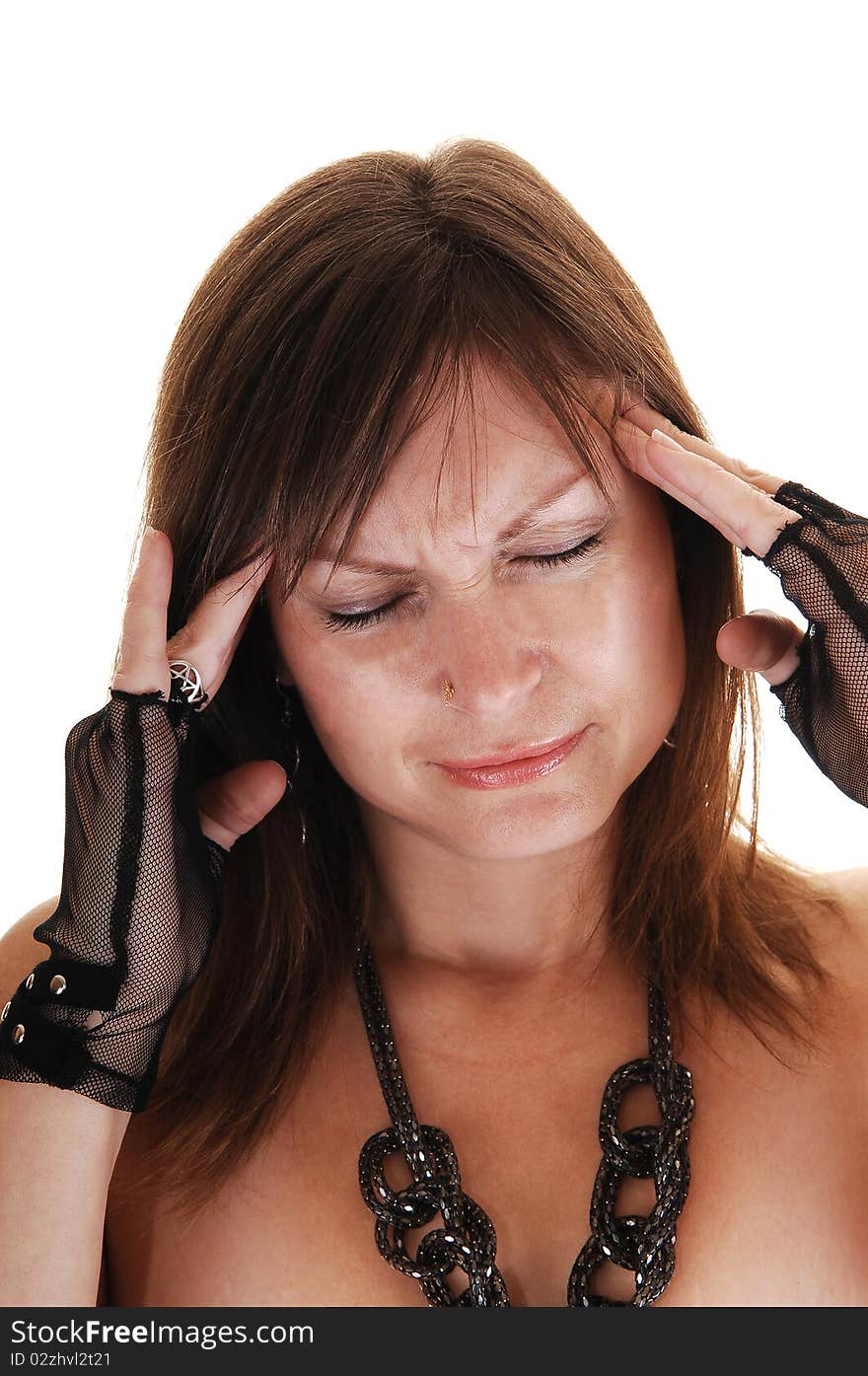 A middle aged woman holding her fingers on her head, she has
a severe headache. A middle aged woman holding her fingers on her head, she has
a severe headache.