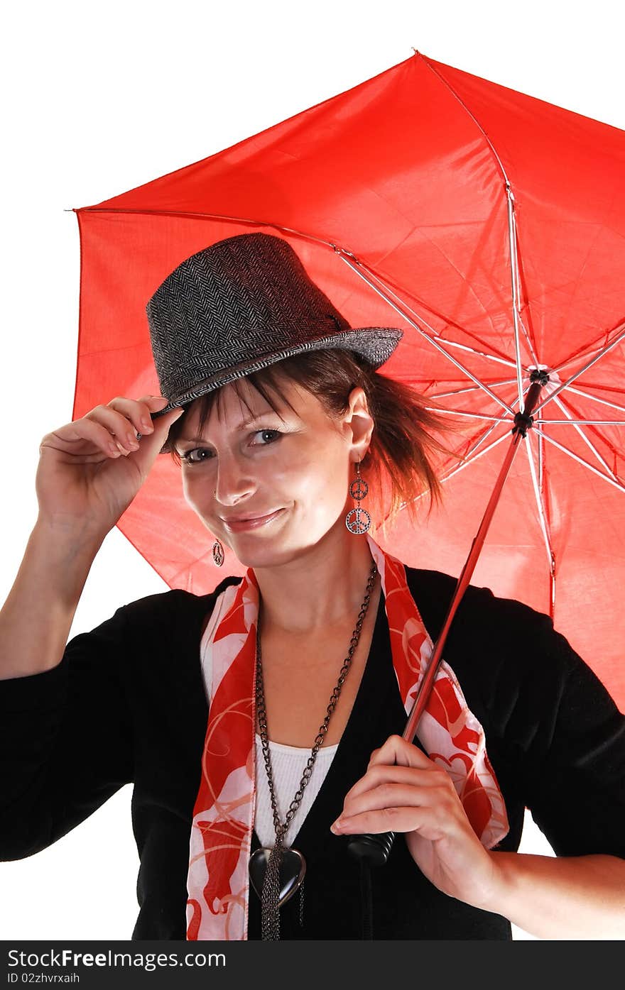 An middle aged woman in an black sweater and a gray hat standing
in the studio with a red umbrella in her hand. An middle aged woman in an black sweater and a gray hat standing
in the studio with a red umbrella in her hand.