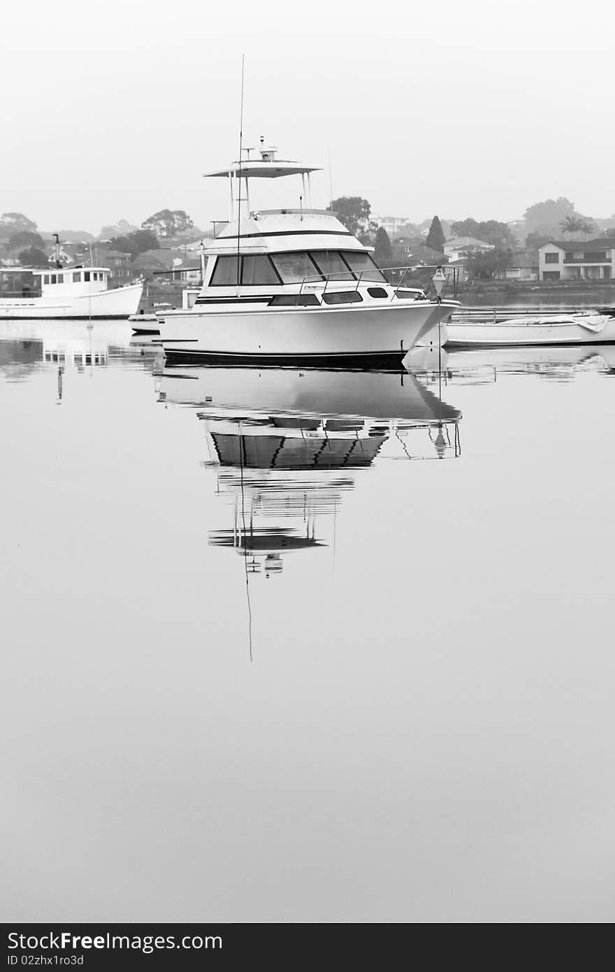 Luxury Cruiser Moored On Still Water