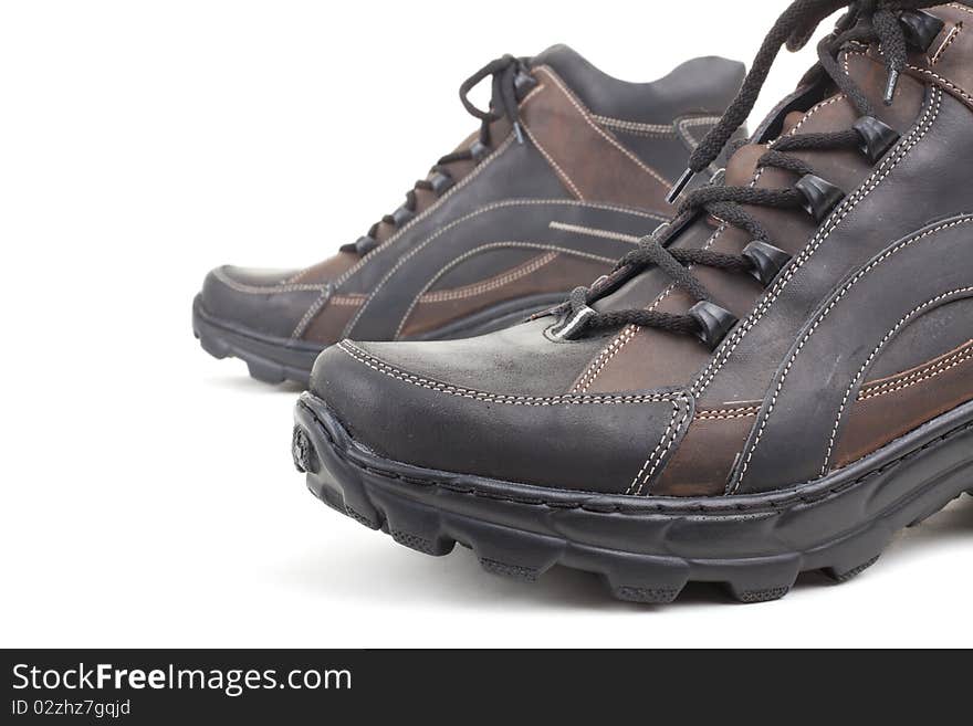 Series. Black leather shoes on a white background