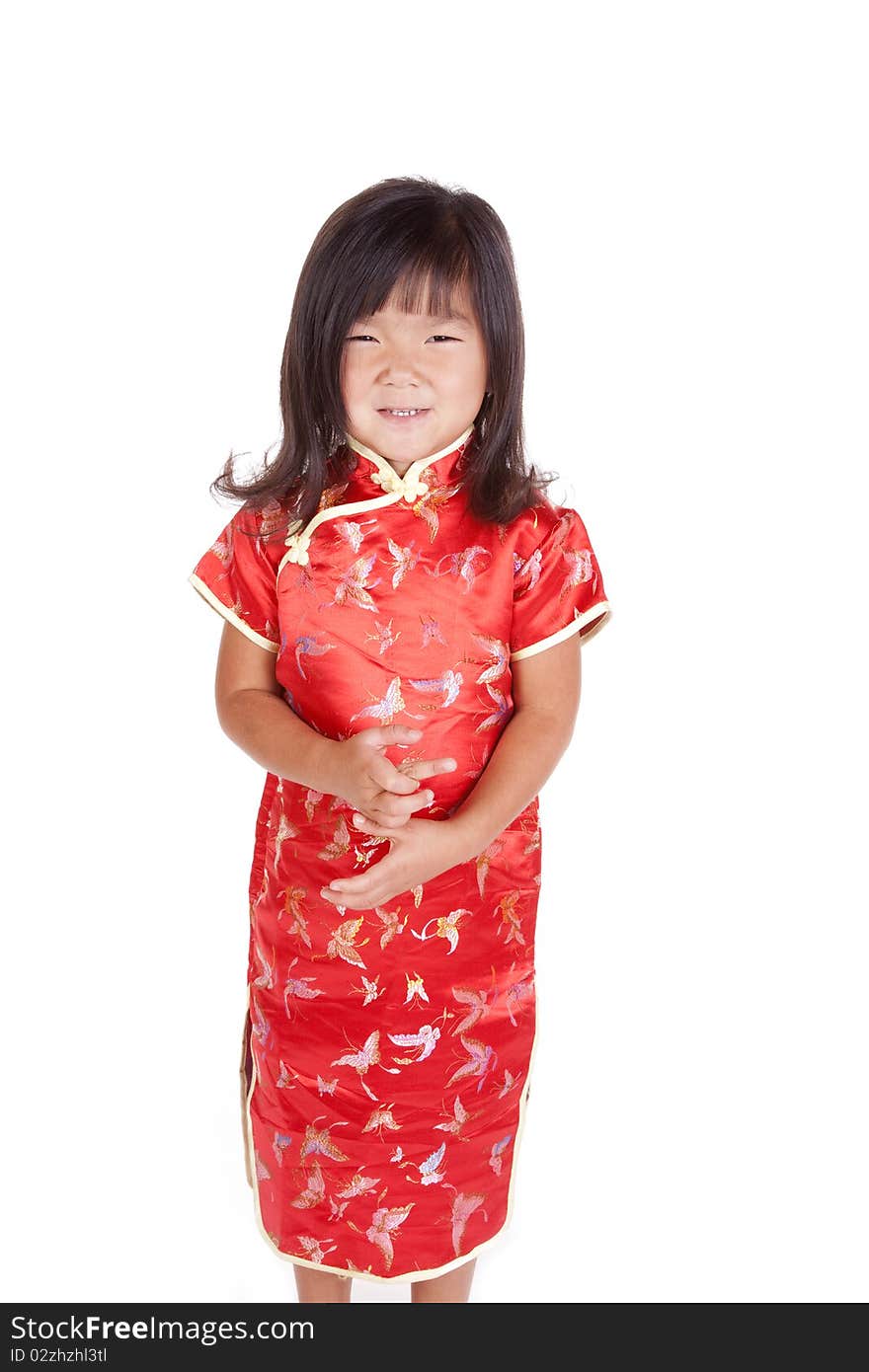 A young Chinese girl is standing with a smile. A young Chinese girl is standing with a smile.