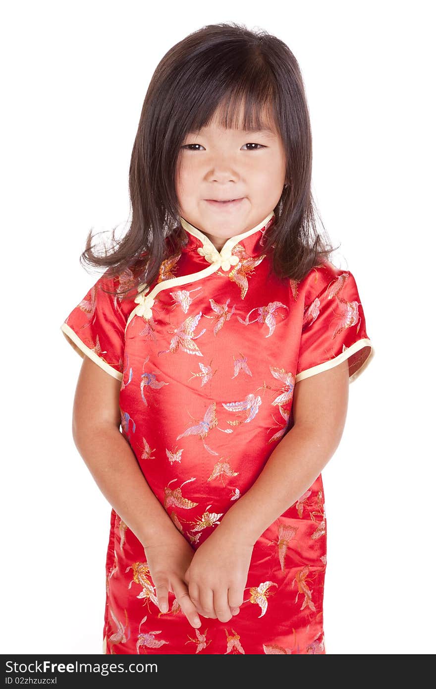 A young chinese girl is standing with a smile. A young chinese girl is standing with a smile.