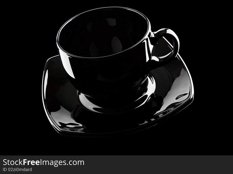 Black empty cup isolated on a white background. Black empty cup isolated on a white background