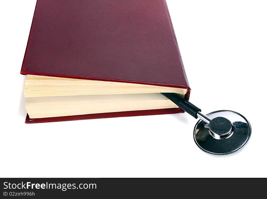 Book and stethoscope isolated on white background