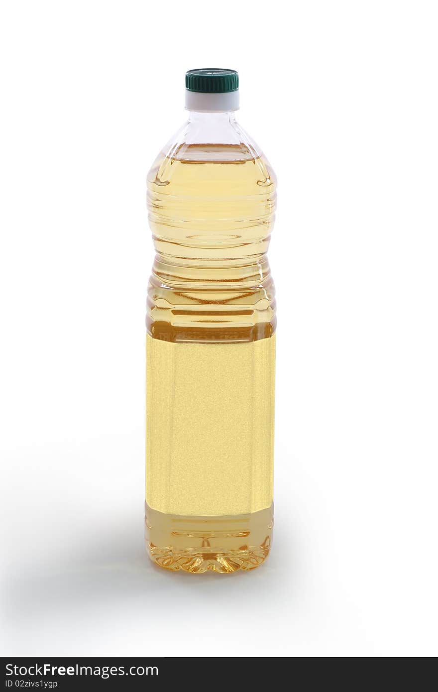 A bottle of light colored vegetable oil with blank label - clipping path included. A bottle of light colored vegetable oil with blank label - clipping path included