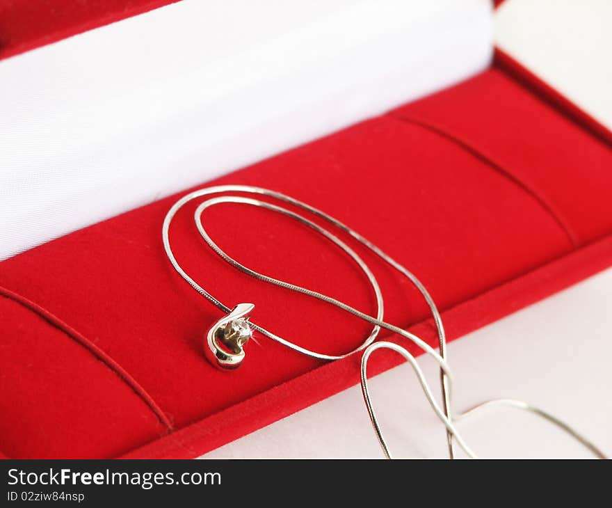 Gold necklace in red jewel box