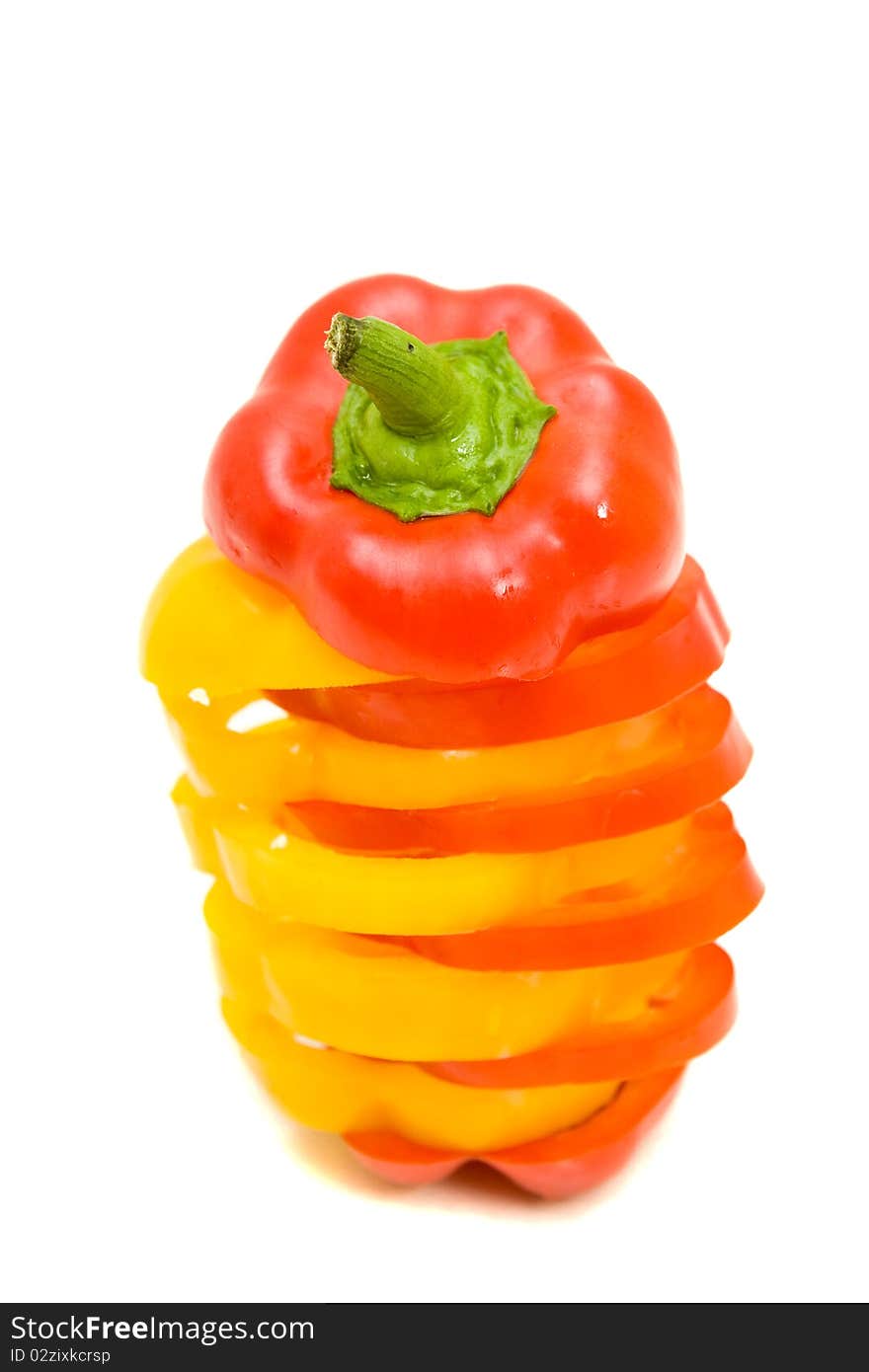 Fresh yellow and red pepper on white background